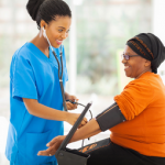woman getting her blood pressure taken as a part of the cardio-oncology program at Northside