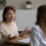 Woman talking with doctor